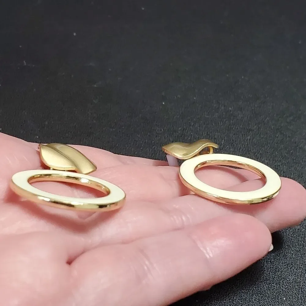 Gold tone cream enamel earrings round dangling